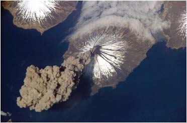 FIGURE 4.14 Eruption of Cleveland Volcano, Aleutian Islands. Alaska is featured in this image photographed by an Expedition 13 crewmember on the International Space Station. This eruption was first reported to the Alaska Volcano Observatory by astronaut Jeffrey N. Williams, NASA space station science officer and flight engineer. NASA Photo ID: ISS013-E-24184 (23 May 2006). SOURCE: Courtesy of NASA.