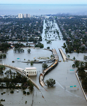 New Orleans, Louisiana, in the aftermath of Hurricane Katrina, showing Interstate 10 at West End Boulevard, looking toward Lake Pontchartrain. This photo is from the U.S. Coast Guard’s initial Hurricane Katrina damage assessment overflights of New Orleans. SOURCE: U.S. Coast Guard, Petty Officer 2nd Class Kyle Niemi.